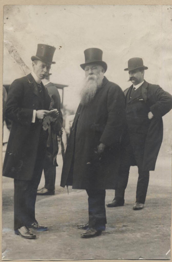Black and White image of three smartly dressed men.